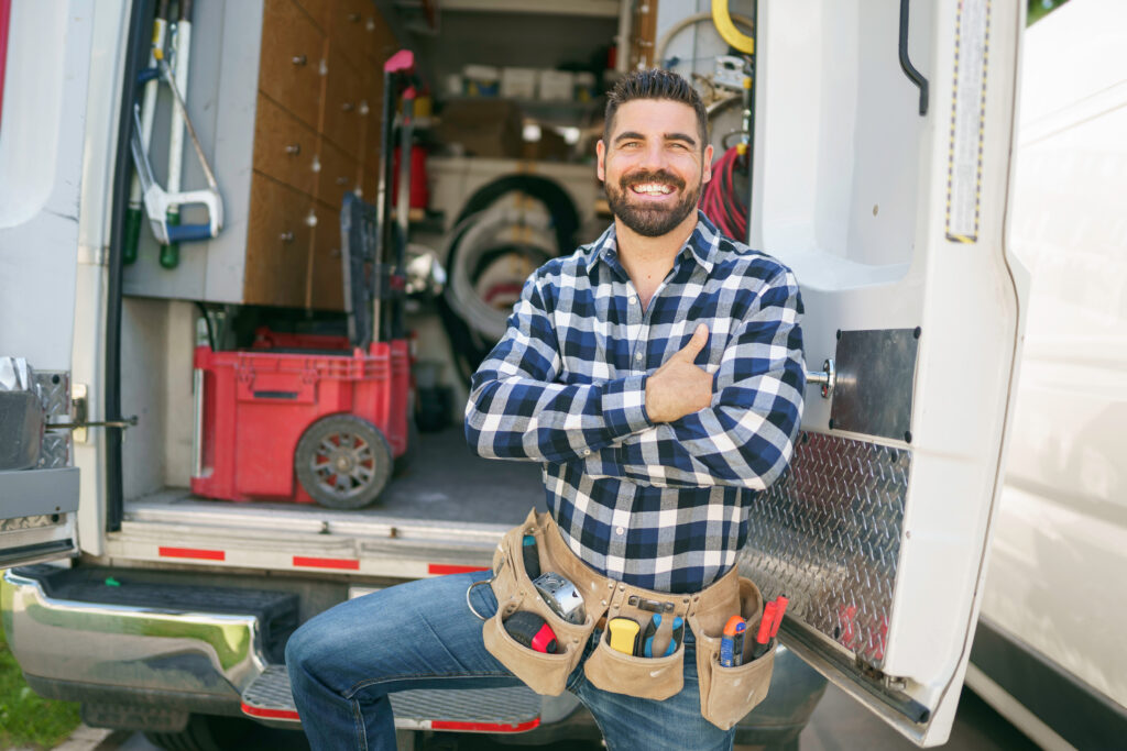 Portrait of an electrician happy worker at work ready for whole house electrical rewiring